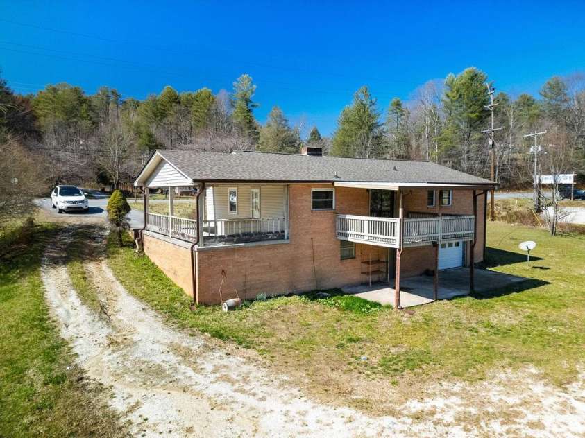 1757 Rosman Highway, Brevard, NC 28712.  MLS# CAR4234818, YatesRealty ID 2310. Back of Home