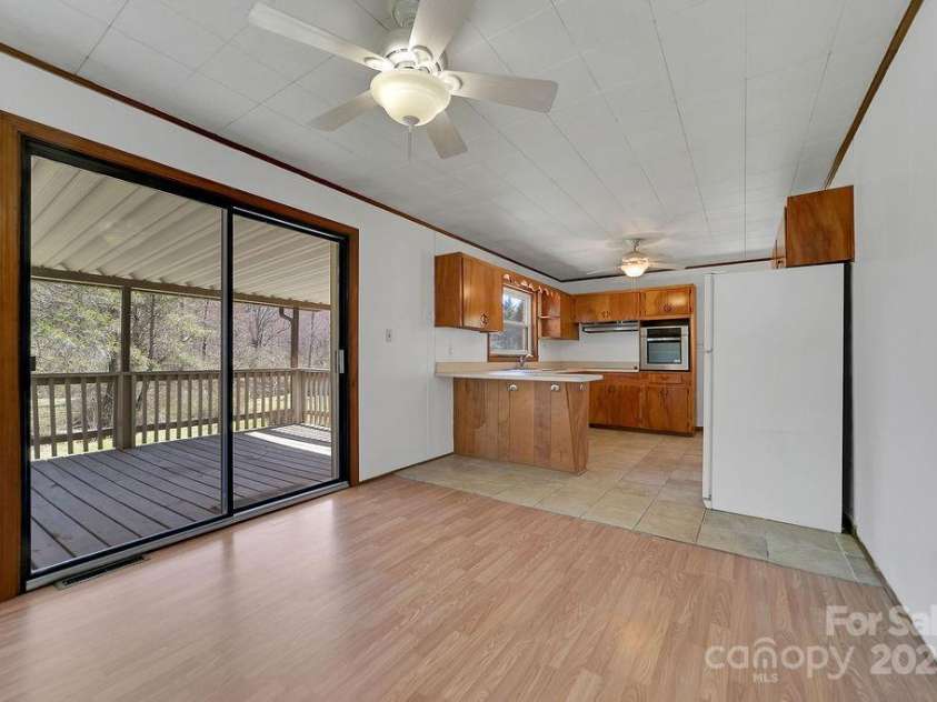 1757 Rosman Highway, Brevard, NC 28712.  MLS# CAR4234818, YatesRealty ID 2310. Dining to Deck