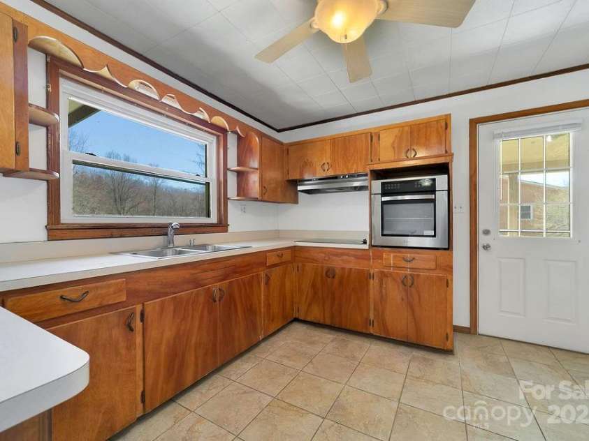 1757 Rosman Highway, Brevard, NC 28712.  MLS# CAR4234818, YatesRealty ID 2310. Plenty of Cabinets