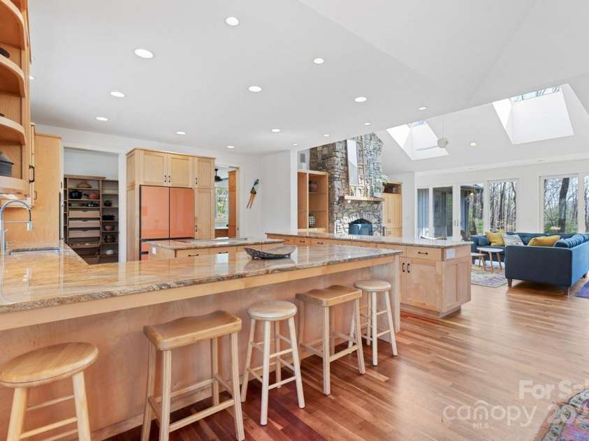 425 Bull Creek Road, Asheville, NC 28805.  MLS# CAR4251410, YatesRealty ID 23105. Open-concept main living area with seamless flow from kitchen to dining to living room.