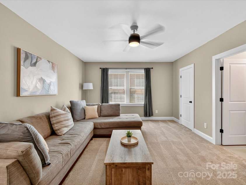 12220 Huntersville Concord Road, Huntersville, NC 28078.  MLS# CAR4301471, YatesRealty ID 23109. Bedroom #3 or Flex space for additional recreation and ensuite bathroom. Plush new carpet, closet and ceiling fan with light. Located in the basement