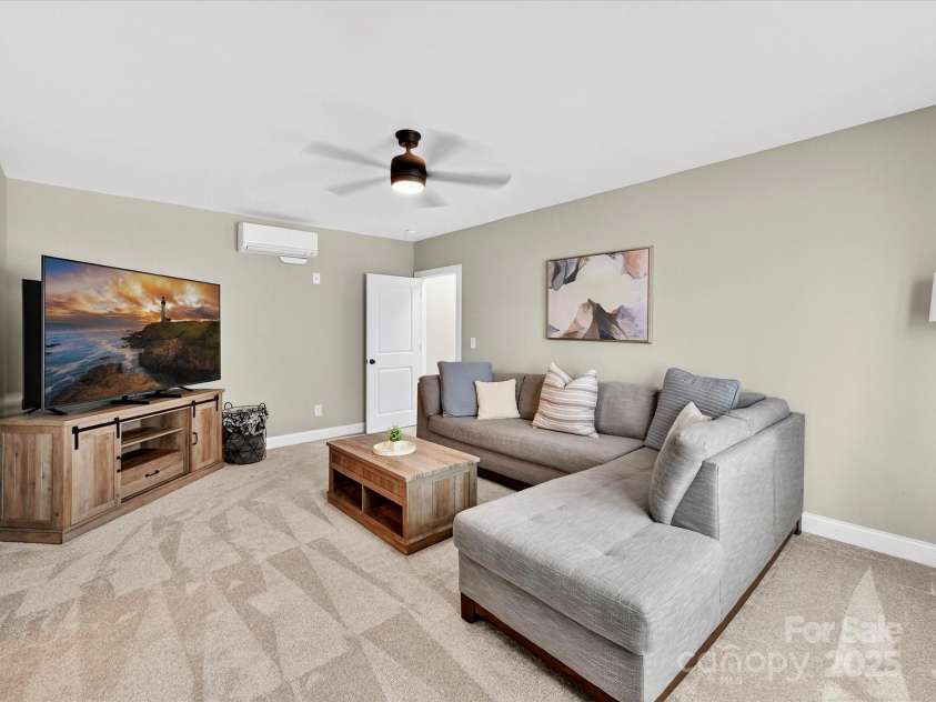 12220 Huntersville Concord Road, Huntersville, NC 28078.  MLS# CAR4301471, YatesRealty ID 23109. Bedroom #3 or Flex space for additional recreation and ensuite bathroom. Plush new carpet, closet and ceiling fan with light. Located in the basement