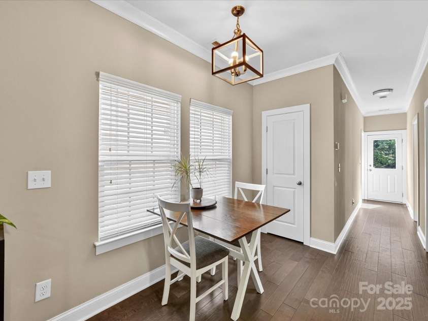 12220 Huntersville Concord Road, Huntersville, NC 28078.  MLS# CAR4301471, YatesRealty ID 23109. Dining Area with hardwood floors and chandalier