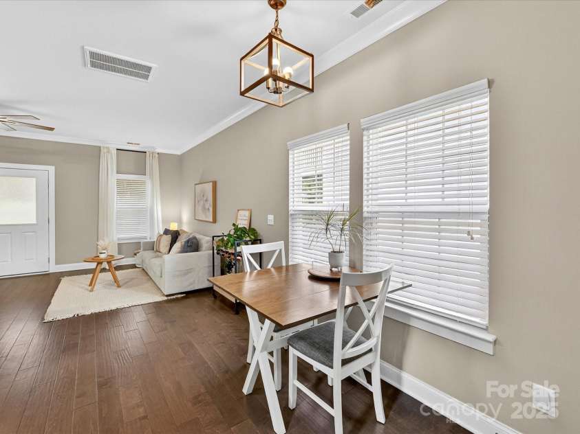 12220 Huntersville Concord Road, Huntersville, NC 28078.  MLS# CAR4301471, YatesRealty ID 23109. Dining Area with hardwood floors and chandalier