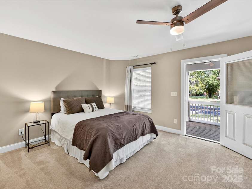 12220 Huntersville Concord Road, Huntersville, NC 28078.  MLS# CAR4301471, YatesRealty ID 23109. Large Primary Bedroom with plush carpeting , renovated primary closet, ensuite bathroom and private balcony!