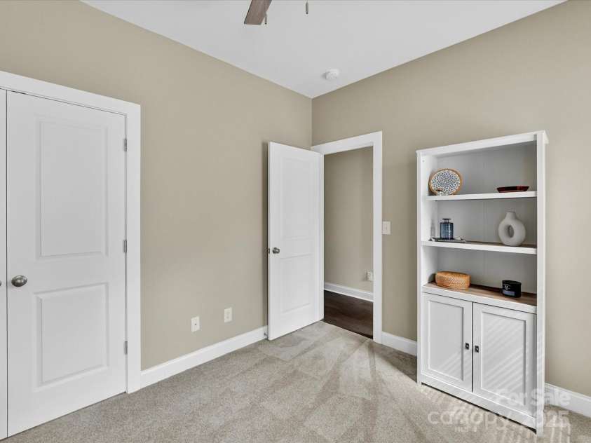 12220 Huntersville Concord Road, Huntersville, NC 28078.  MLS# CAR4301471, YatesRealty ID 23109. Main level Bedroom #1 or Flex space for an Office. New plush carpet, double door closet space, tons of light and ceiling fan