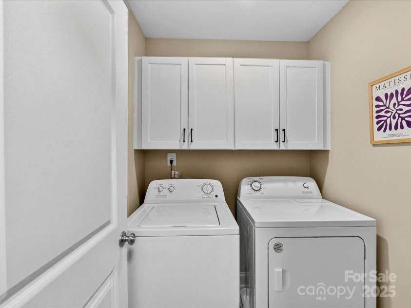 12220 Huntersville Concord Road, Huntersville, NC 28078.  MLS# CAR4301471, YatesRealty ID 23109. Spacious Laundry room with tons of storage. New shaker cabinets!