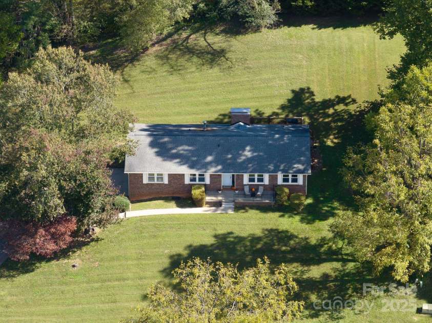 16 Sun Valley Court, Alexander, NC 28701.  MLS# CAR4263633, YatesRealty ID 23110. Beautiful mature trees