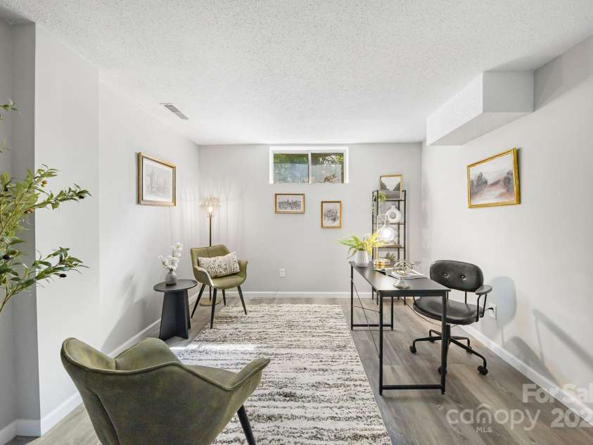 16 Sun Valley Court, Alexander, NC 28701.  MLS# CAR4263633, YatesRealty ID 23110. Downstairs office area