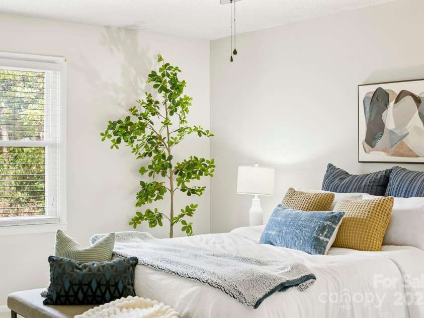 16 Sun Valley Court, Alexander, NC 28701.  MLS# CAR4263633, YatesRealty ID 23110. Large primary bedroom with ensuite full bath