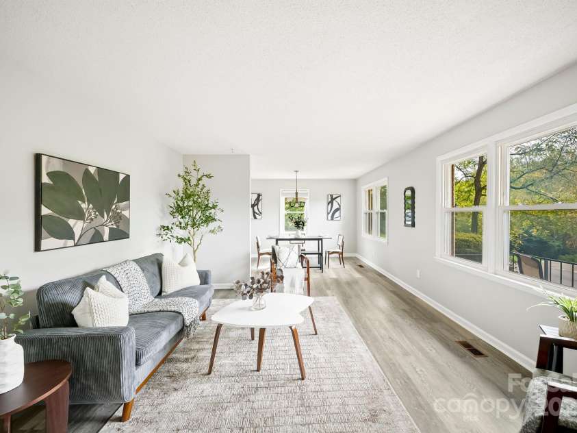 16 Sun Valley Court, Alexander, NC 28701.  MLS# CAR4263633, YatesRealty ID 23110. Living room and dining room 