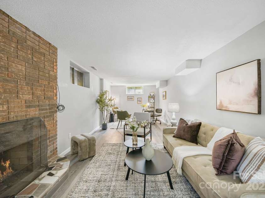 16 Sun Valley Court, Alexander, NC 28701.  MLS# CAR4263633, YatesRealty ID 23110. Spacious great room downstairs with office space