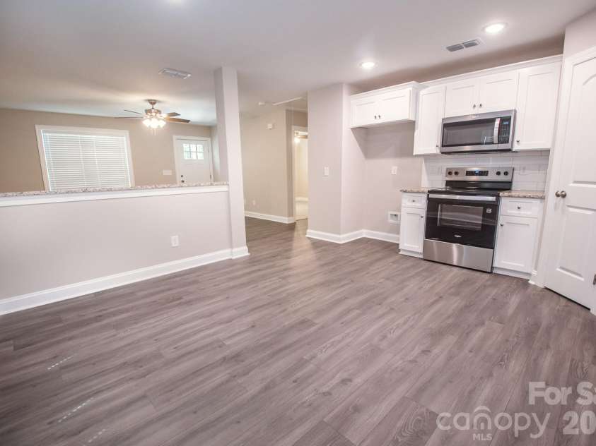 415 Jackson Street, Albemarle, NC 28001.  MLS# CAR4373476, YatesRealty ID 23110. Kitchen/dining area