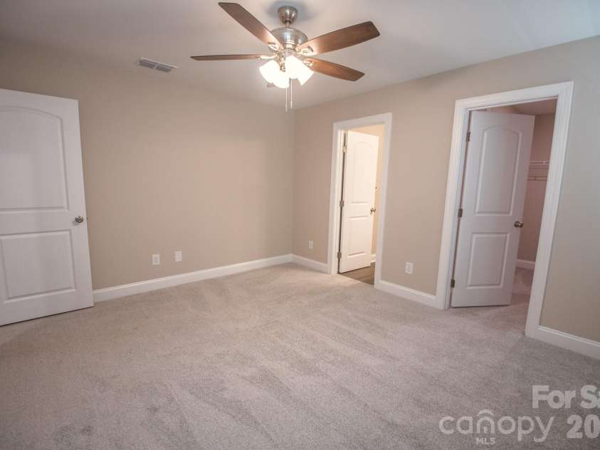 415 Jackson Street, Albemarle, NC 28001.  MLS# CAR4373476, YatesRealty ID 23110. Primary bedroom