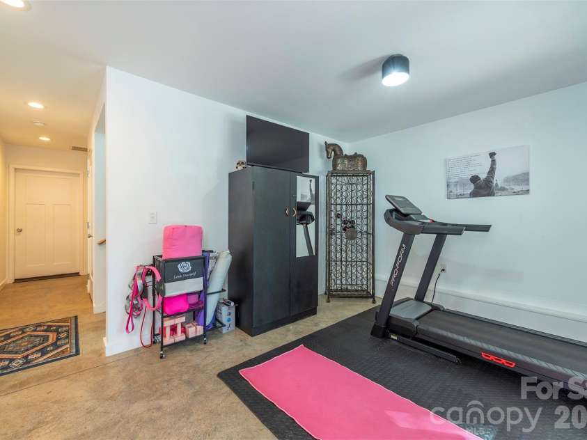 84 West Street, Weaverville, NC 28787.  MLS# CAR4334838, YatesRealty ID 23114. Exercise Area - Lower Level