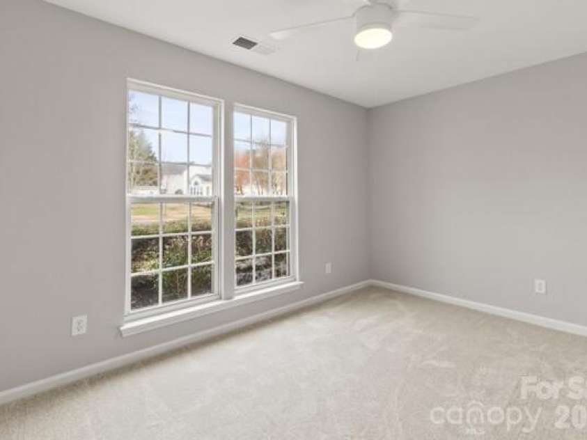 11619 Planters Estates Drive, Charlotte, NC 28278.  MLS# CAR4423181, YatesRealty ID 23116. New carpet and ceiling fan in front bedroom