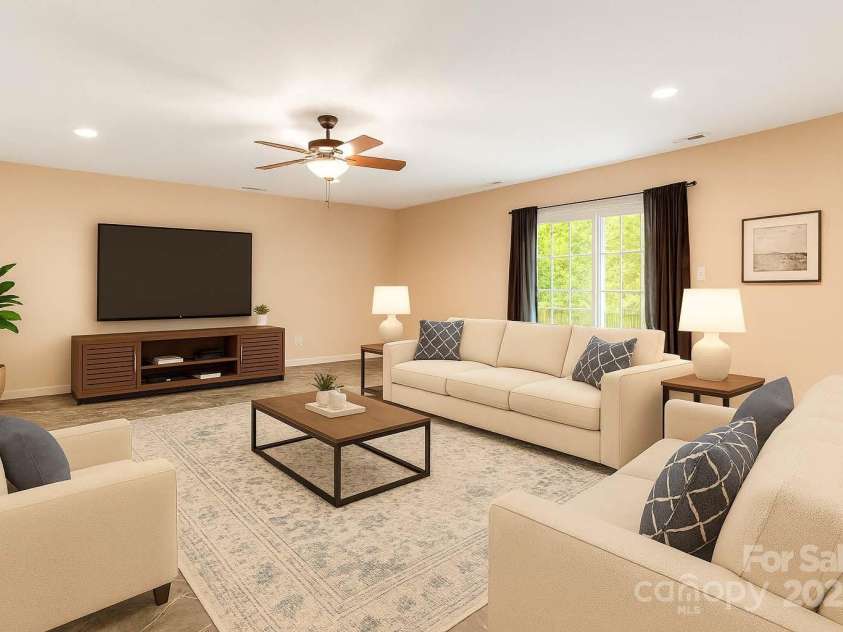 18 & 28 Sunberry Drive, Alexander, NC 28701.  MLS# CAR4266068, YatesRealty ID 23120. AI Digitally Staged Downstairs Family Room/Den
