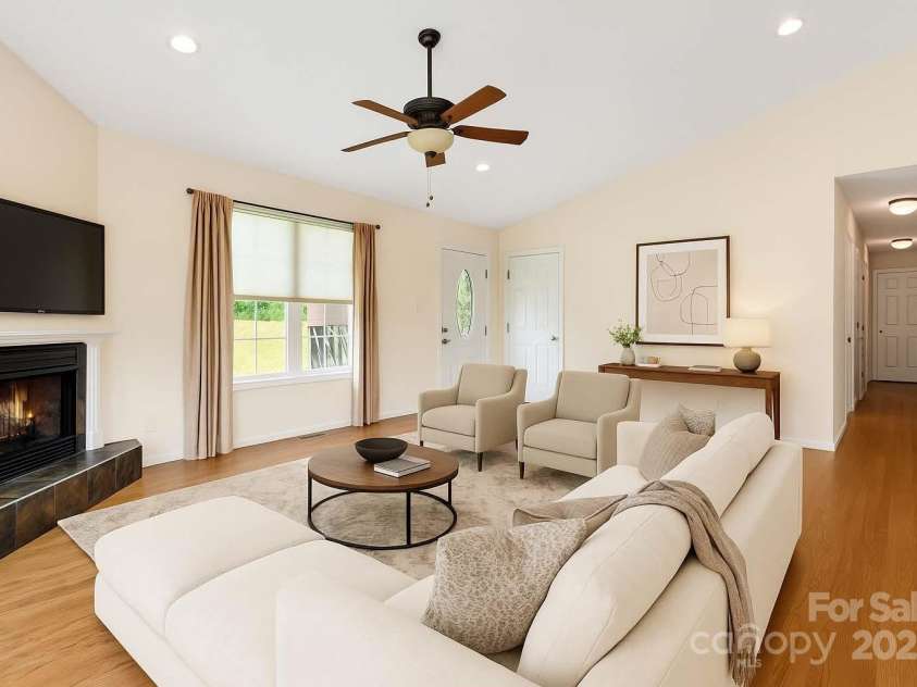 18 & 28 Sunberry Drive, Alexander, NC 28701.  MLS# CAR4266068, YatesRealty ID 23120. AI Digitally Staged Living Room Option 1