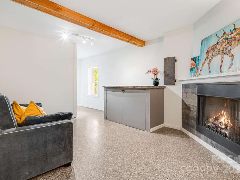 25 Frannys Farm Road, Leicester, NC 28748.  MLS# CAR4269407, YatesRealty ID 23129. Basement Lounge