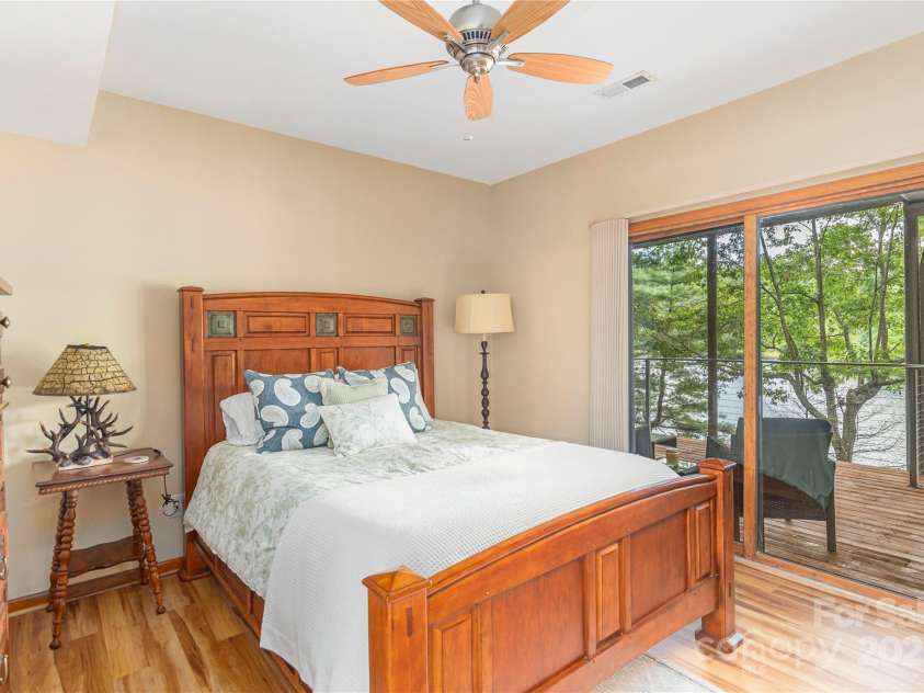 324 Cheulah Road, Brevard, NC 28712.  MLS# CAR4272420, YatesRealty ID 23130. Downstairs bedroom #1 with door to lower lakeview porch
