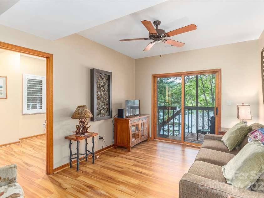 324 Cheulah Road, Brevard, NC 28712.  MLS# CAR4272420, YatesRealty ID 23130. Downstairs living room and office (could be used as 4th bedroom)