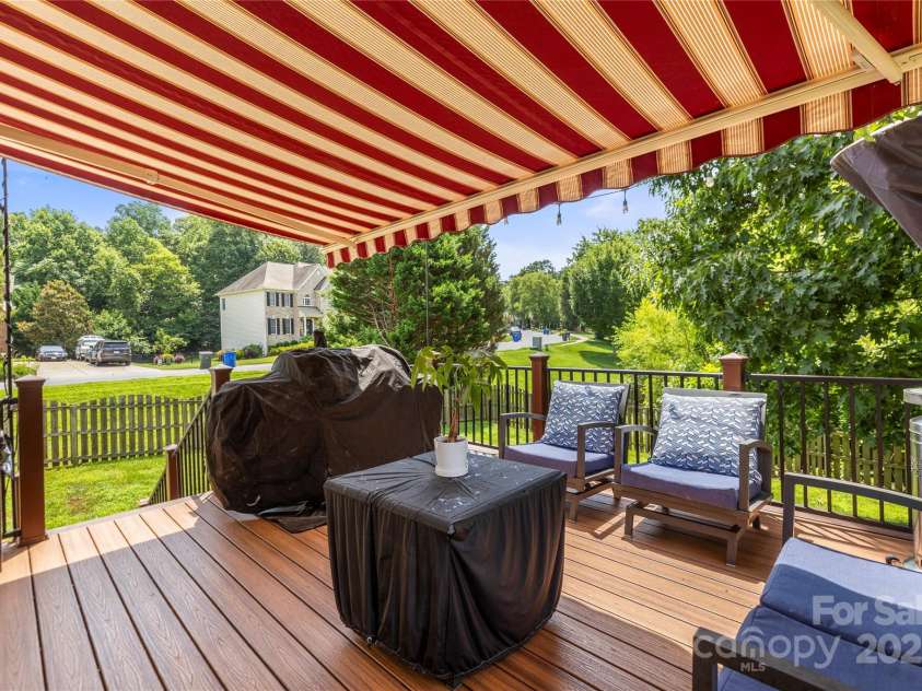 128 Sugar Thyme Lane, Mooresville, NC 28115.  MLS# CAR4266649, YatesRealty ID 23132. Deck with remote controlled shade