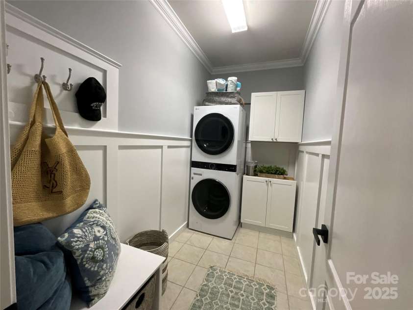 2007 Bishops Court, Cornelius, NC 28031.  MLS# CAR4257347, YatesRealty ID 23133. Laundry Room on Main Level features a Drop Zone, crown molding and board & batten.