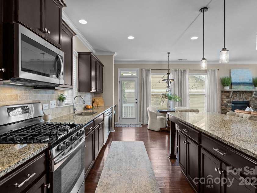 2007 Bishops Court, Cornelius, NC 28031.  MLS# CAR4257347, YatesRealty ID 23133. Oversized Island sits 55” from perimeter countertops