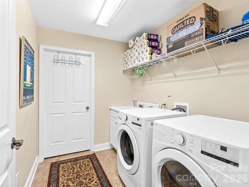 60 Mountain Meadow Circle, Weaverville, NC 28787.  MLS# CAR4382244, YatesRealty ID 23140. Laundry room with extra large storage closet