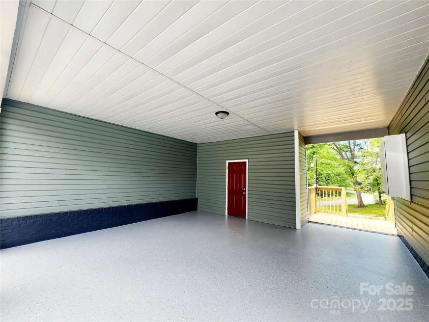 501 Hawthorne Street, Mount Holly, NC 28120.  MLS# CAR4250572, YatesRealty ID 23146. Double carport with slip resistant concrete coating