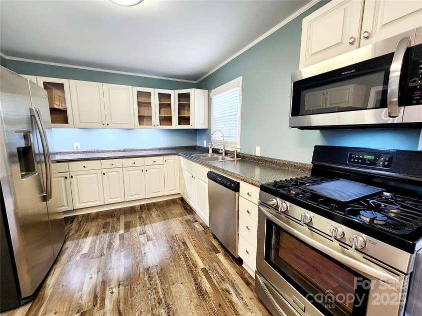 501 Hawthorne Street, Mount Holly, NC 28120.  MLS# CAR4250572, YatesRealty ID 23146. Kitchen with undercabinet lighting