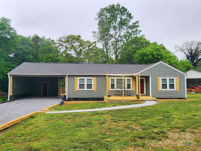 501 Hawthorne Street, Mount Holly, NC 28120.  MLS# CAR4250572, YatesRealty ID 23146. New Siding. Custom Shutters. Double Carport.