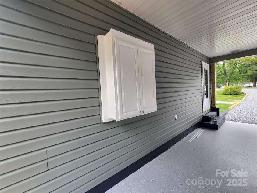 501 Hawthorne Street, Mount Holly, NC 28120.  MLS# CAR4250572, YatesRealty ID 23146. Storage in carport