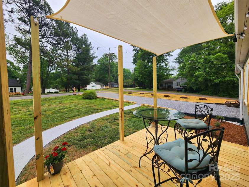 501 Hawthorne Street, Mount Holly, NC 28120.  MLS# CAR4250572, YatesRealty ID 23146. Stunning front porch with sun-sail shade