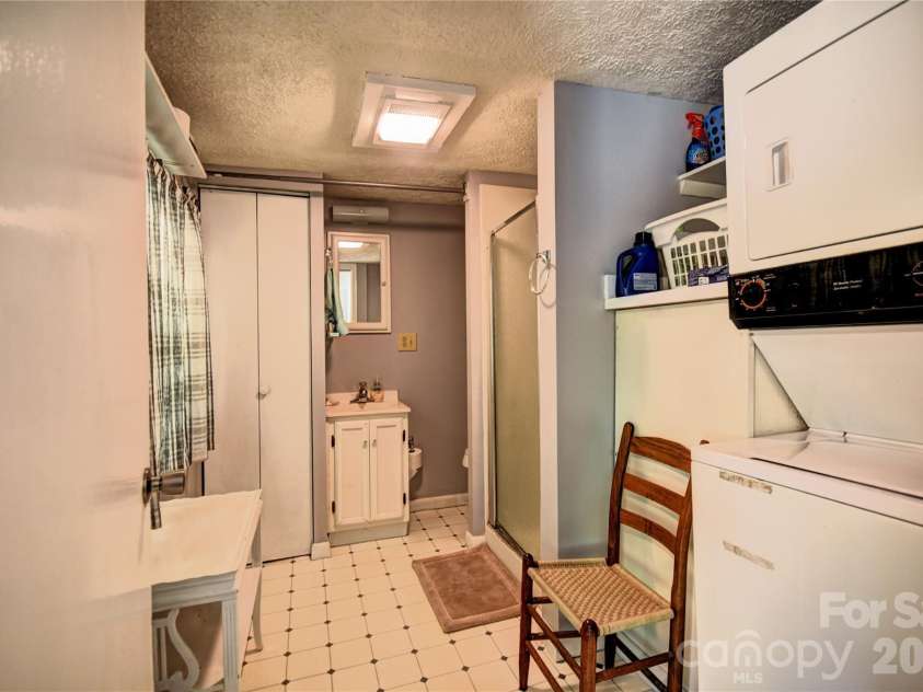 91 Mallard Loop, Waynesville, NC 28785.  MLS# CAR4372848, YatesRealty ID 23150. Bathroom 1 and laundry
