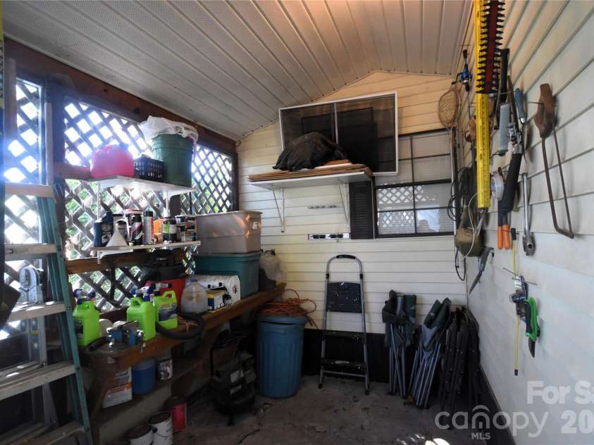91 Mallard Loop, Waynesville, NC 28785.  MLS# CAR4372848, YatesRealty ID 23150. Lockable storage area off the carport