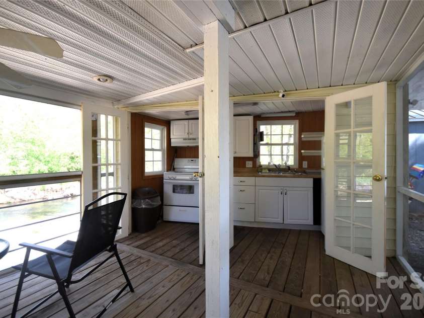 91 Mallard Loop, Waynesville, NC 28785.  MLS# CAR4372848, YatesRealty ID 23150. Outdoor kitchen with the doors opened