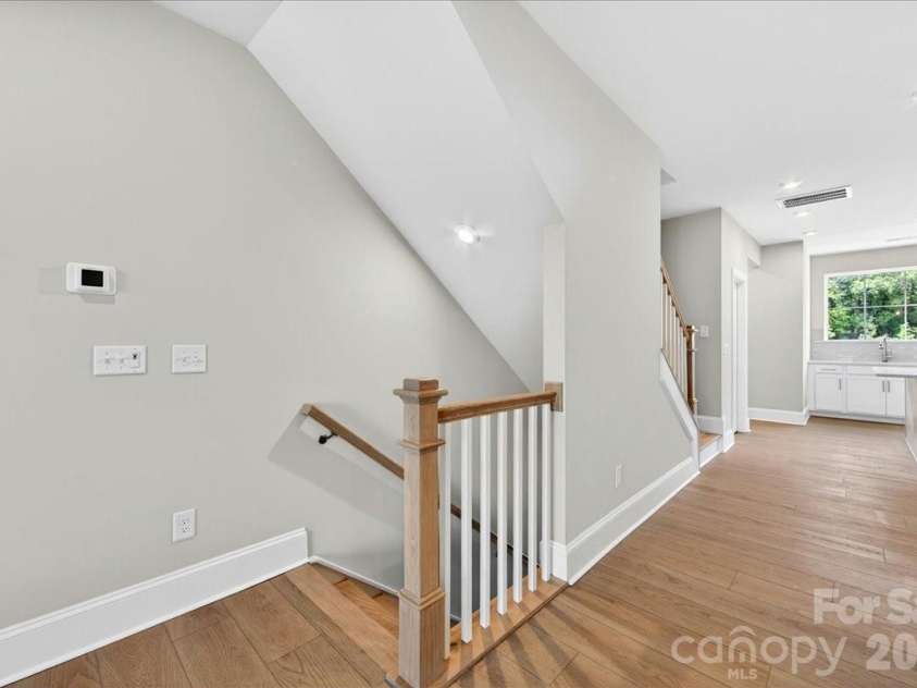 440 Old Town Village Road, Waxhaw, NC 28173.  MLS# CAR4375714, YatesRealty ID 23153. Second floor landing with open rails