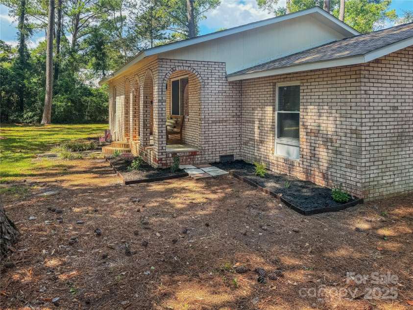6058 Bethel Road, Southport, NC 28461.  MLS# CAR4205452, YatesRealty ID 23157. Side