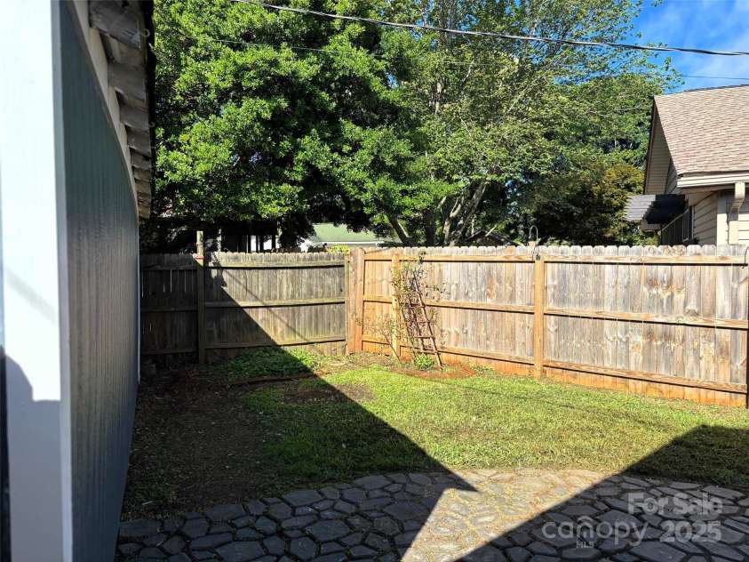 339 Mayflower Avenue, Cramerton, NC 28032.  MLS# CAR4270605, YatesRealty ID 23161. Back yard taken from garage