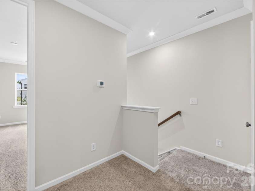 6025 Longar Lane, Charlotte, NC 28269.  MLS# CAR4376910, YatesRealty ID 23163. Second floor landing
