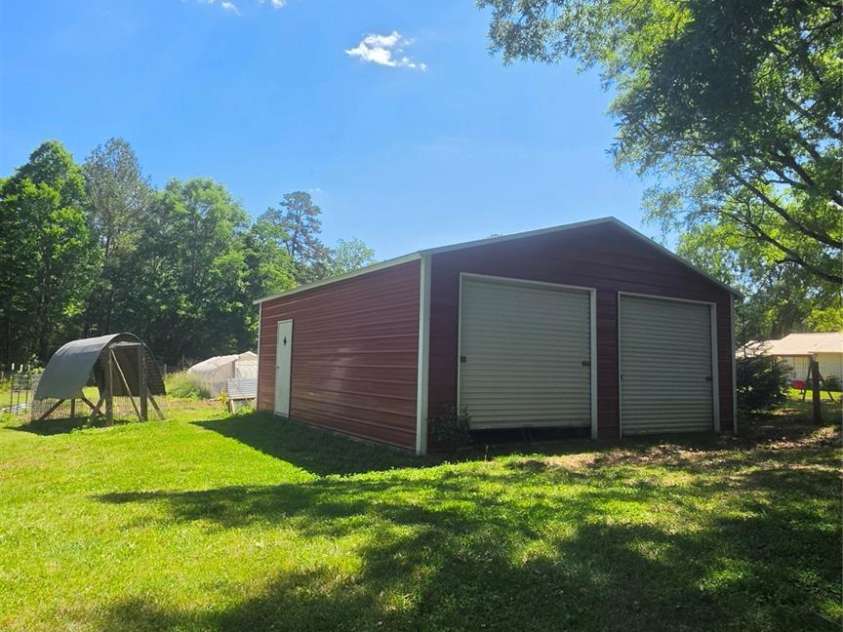 222 Carrie Drive, Oakboro, NC 28129.  MLS# CAR4378806, YatesRealty ID 23165. 24 x 27 with 9' Height, 2- 8 x 9 Roll Doors, Concrete Floor 2- Windows on the Backside and 1-Walk Out Exit Door