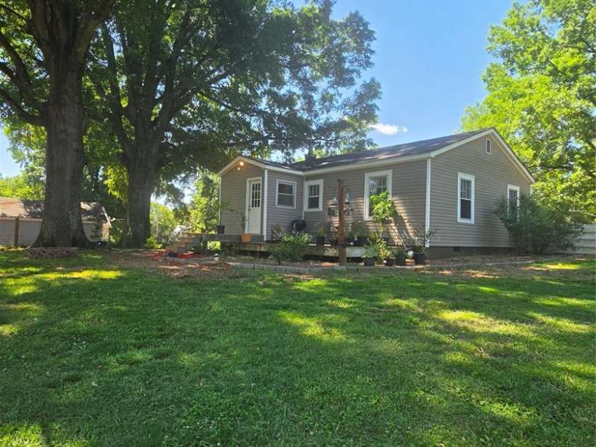 222 Carrie Drive, Oakboro, NC 28129.  MLS# CAR4378806, YatesRealty ID 23165. Back Yard Beautiful Shade Trees and Open Spaces