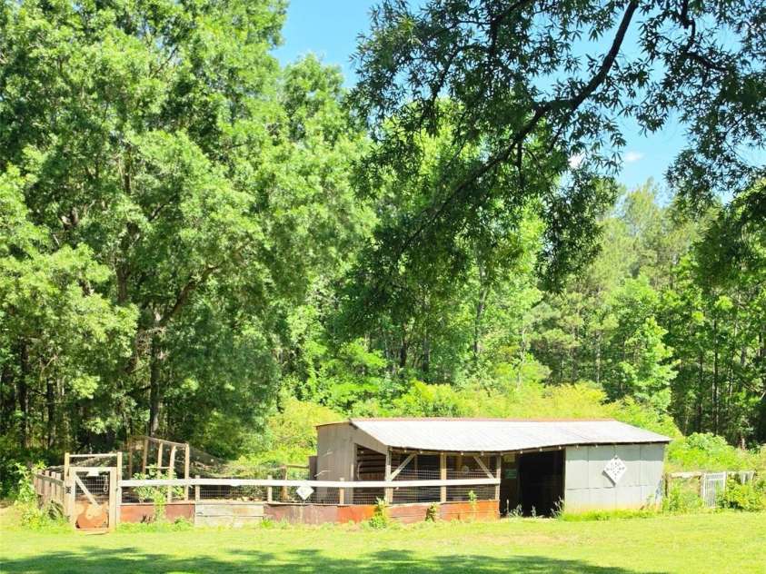 222 Carrie Drive, Oakboro, NC 28129.  MLS# CAR4378806, YatesRealty ID 23165. Shed Has Storage and Coop Ready