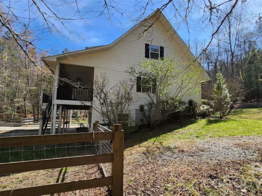 360 River Cove Lane, Hayesville, NC 28904.  MLS# CAR4383418, YatesRealty ID 23166. Left side elevation by driveway #2