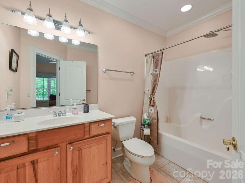 105 Spring Path, Hendersonville, NC 28739.  MLS# CAR4256171, YatesRealty ID 2317. Adjoining lower level guest room bath