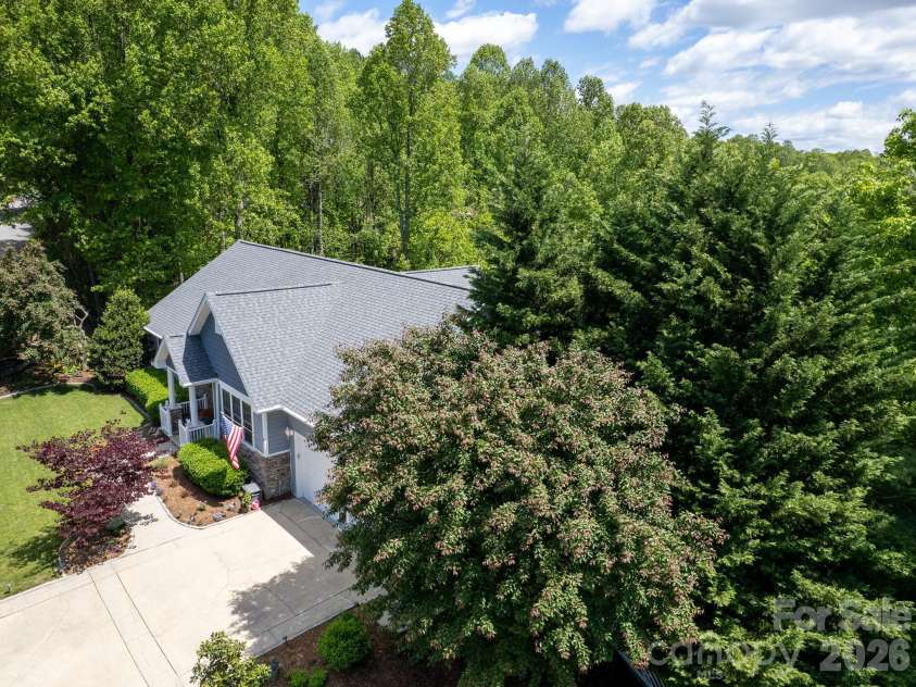 105 Spring Path, Hendersonville, NC 28739.  MLS# CAR4256171, YatesRealty ID 2317. Beautifully wooded, yet light filled