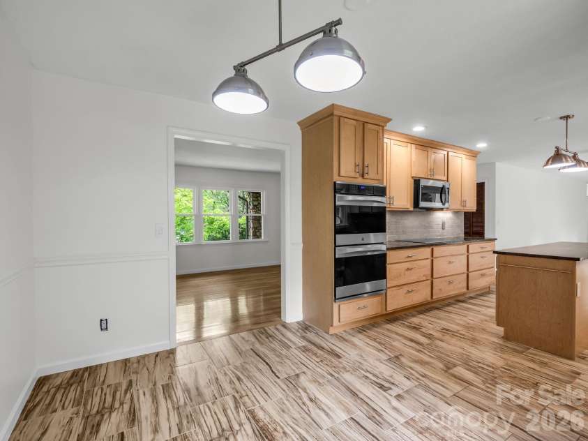 11 Deer Run Drive, Asheville, NC 28803.  MLS# CAR4377673, YatesRealty ID 23171. Dining room opens to kitchen