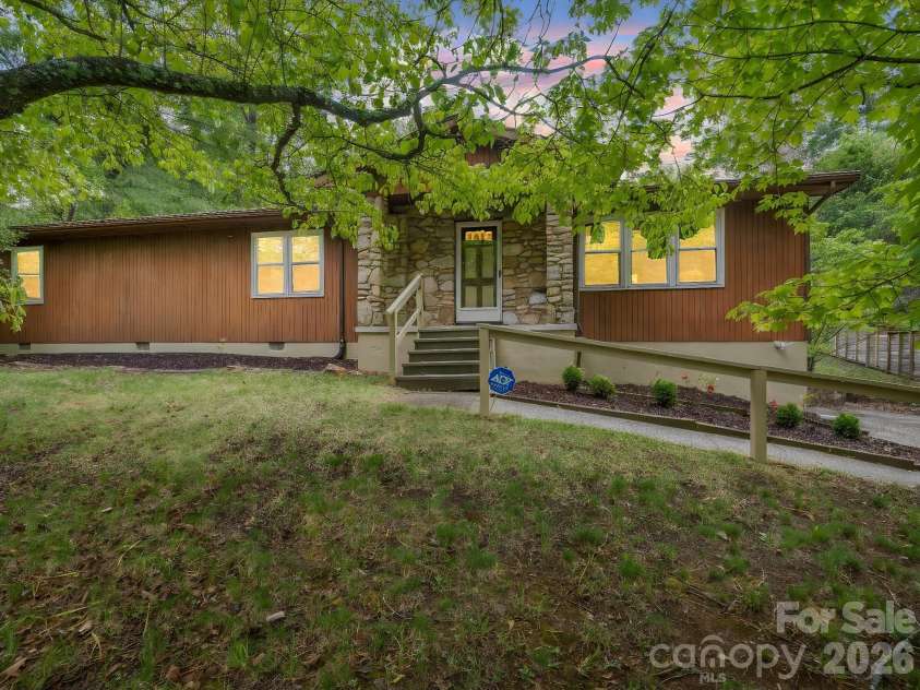 11 Deer Run Drive, Asheville, NC 28803.  MLS# CAR4377673, YatesRealty ID 23171. Nestled in the trees