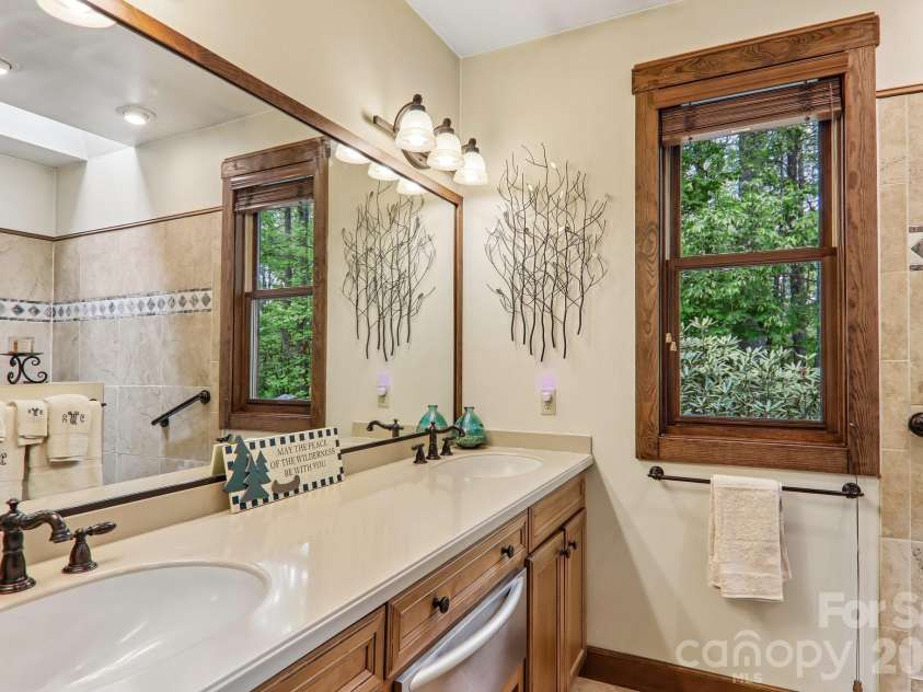 519 Susanna Cove Road, Mars Hill, NC 28754.  MLS# CAR4368251, YatesRealty ID 23179. Guest Bath w/ Custom Tiled Shower
